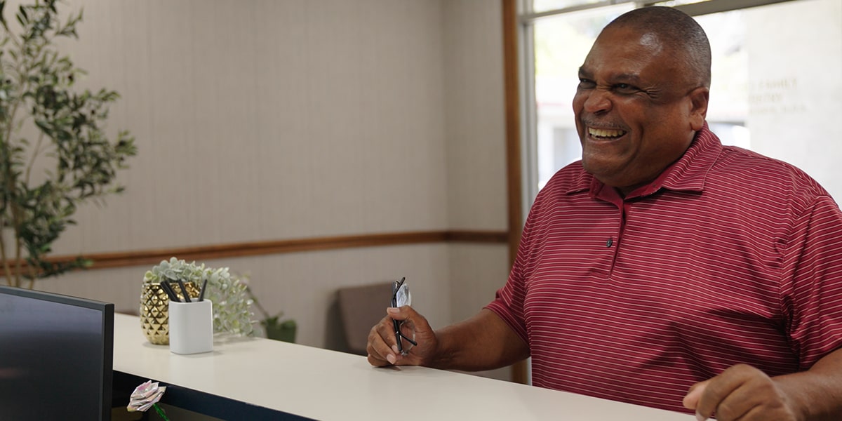 A man is smiling at Vallejo Dental