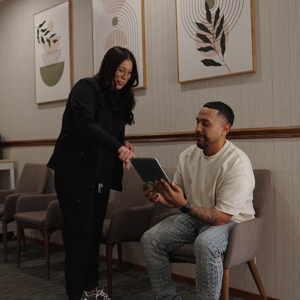 Vallejo Family Dentistry specialist is consulting a happy smiling patient